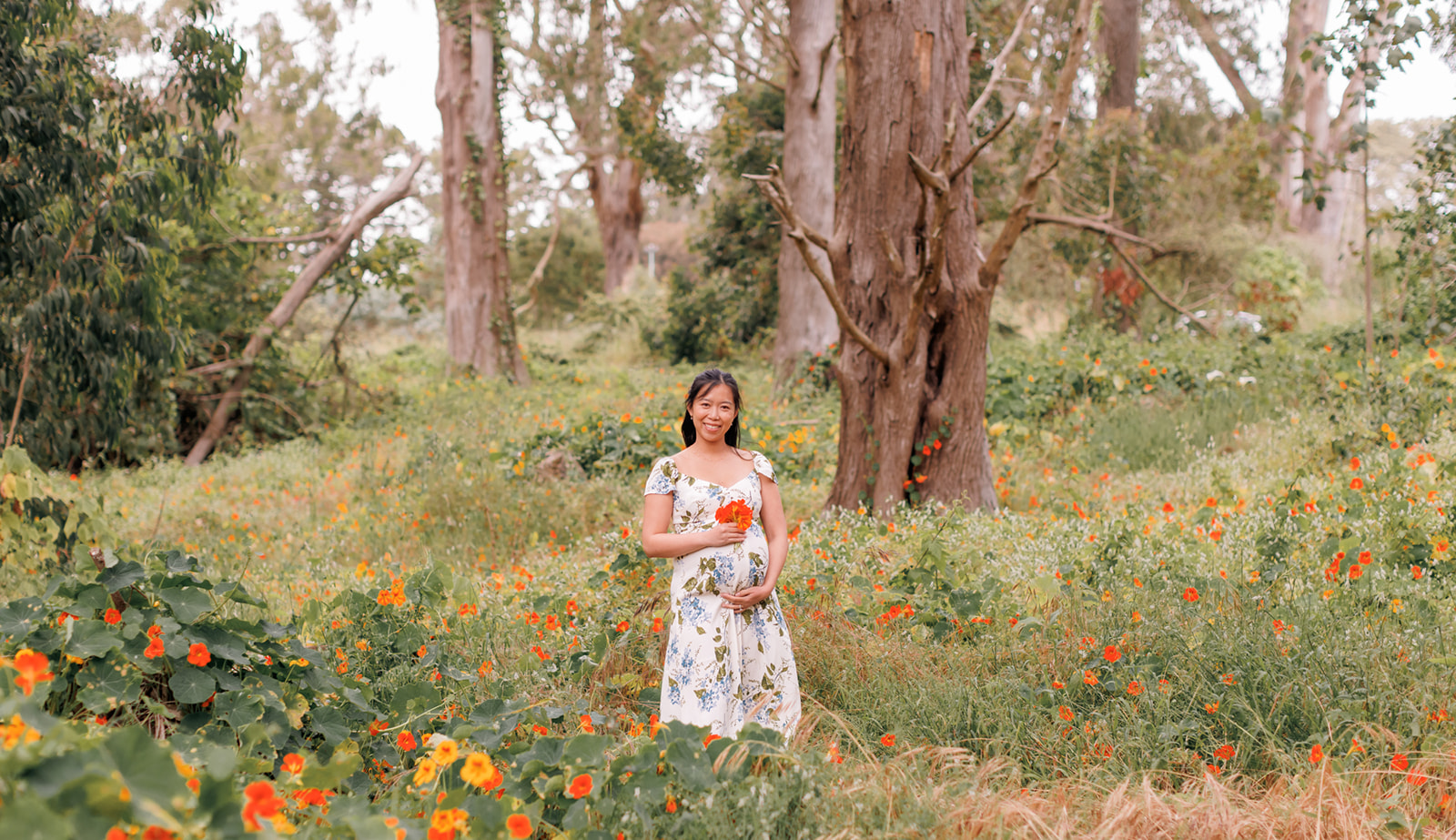  Natural maternity photo shoot, and beautiful grassy area with wildflowers inside Golden Gate Park in San Francisco