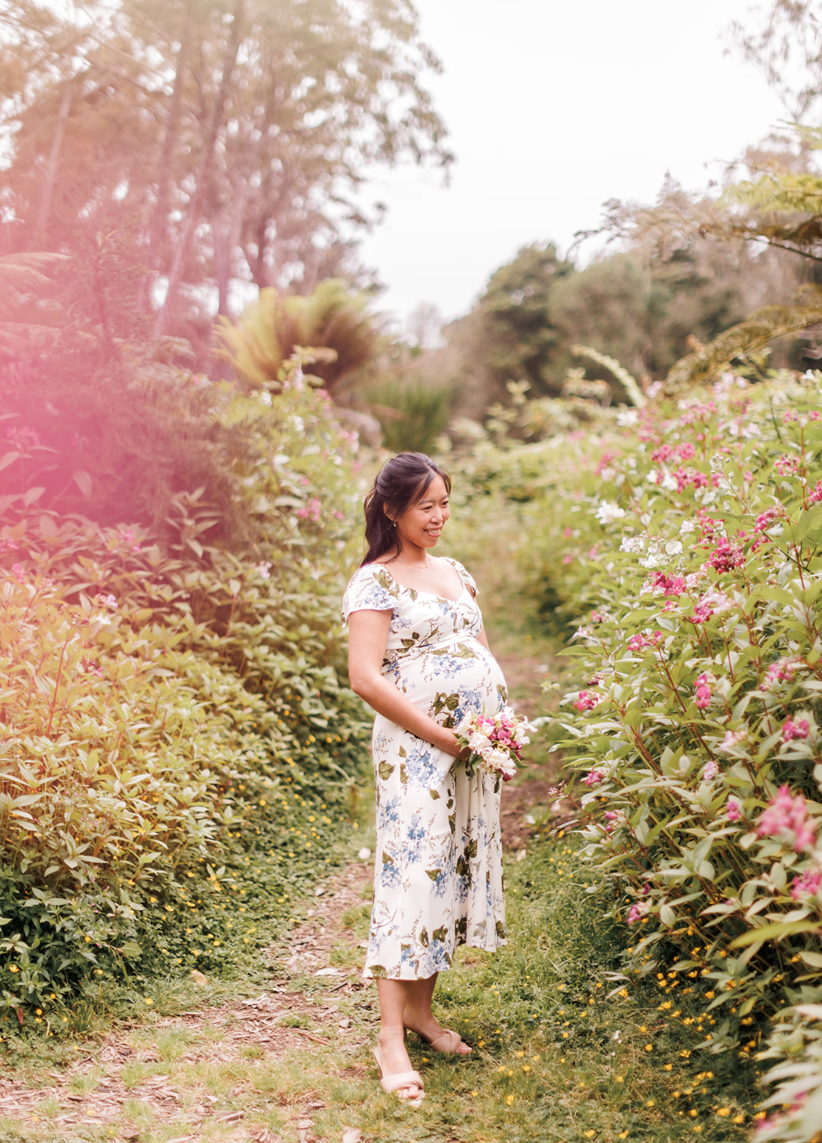Natural maternity photo shoot, and beautiful grassy area with wildflowers inside Golden Gate Park in San Francisco