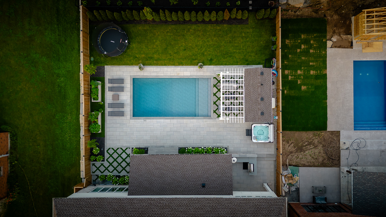 top-down view of the backyard with an inground pool.