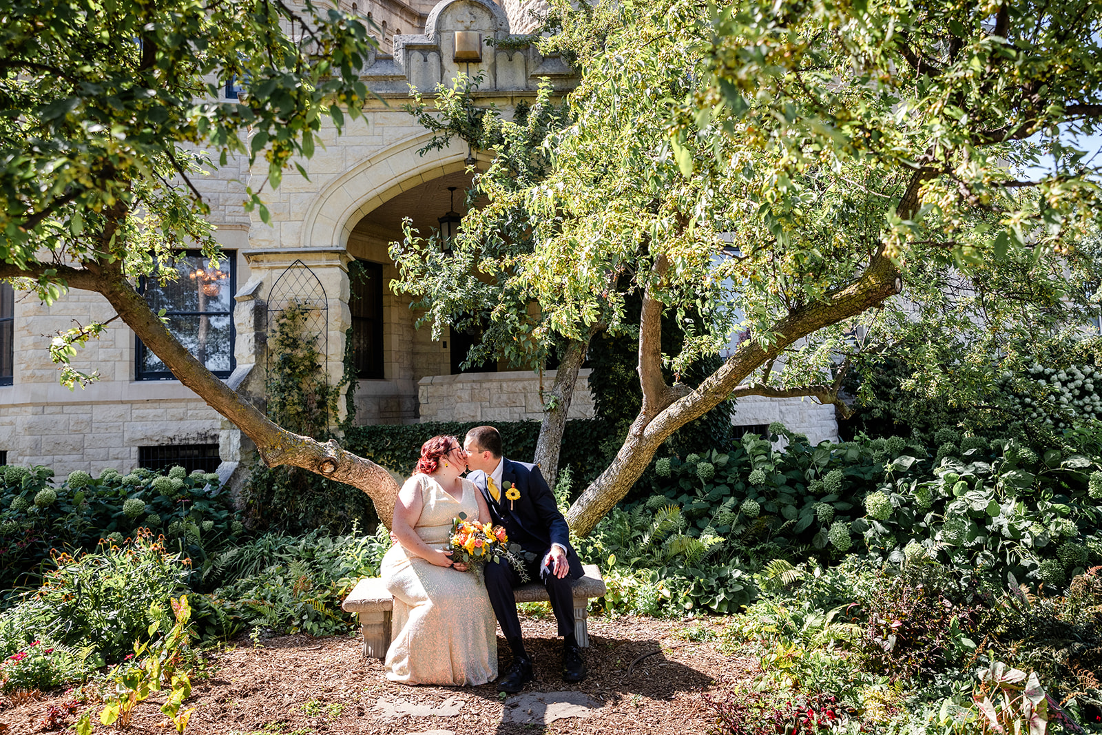 Angela and Mark sitting on a bench at Joslyn Castle