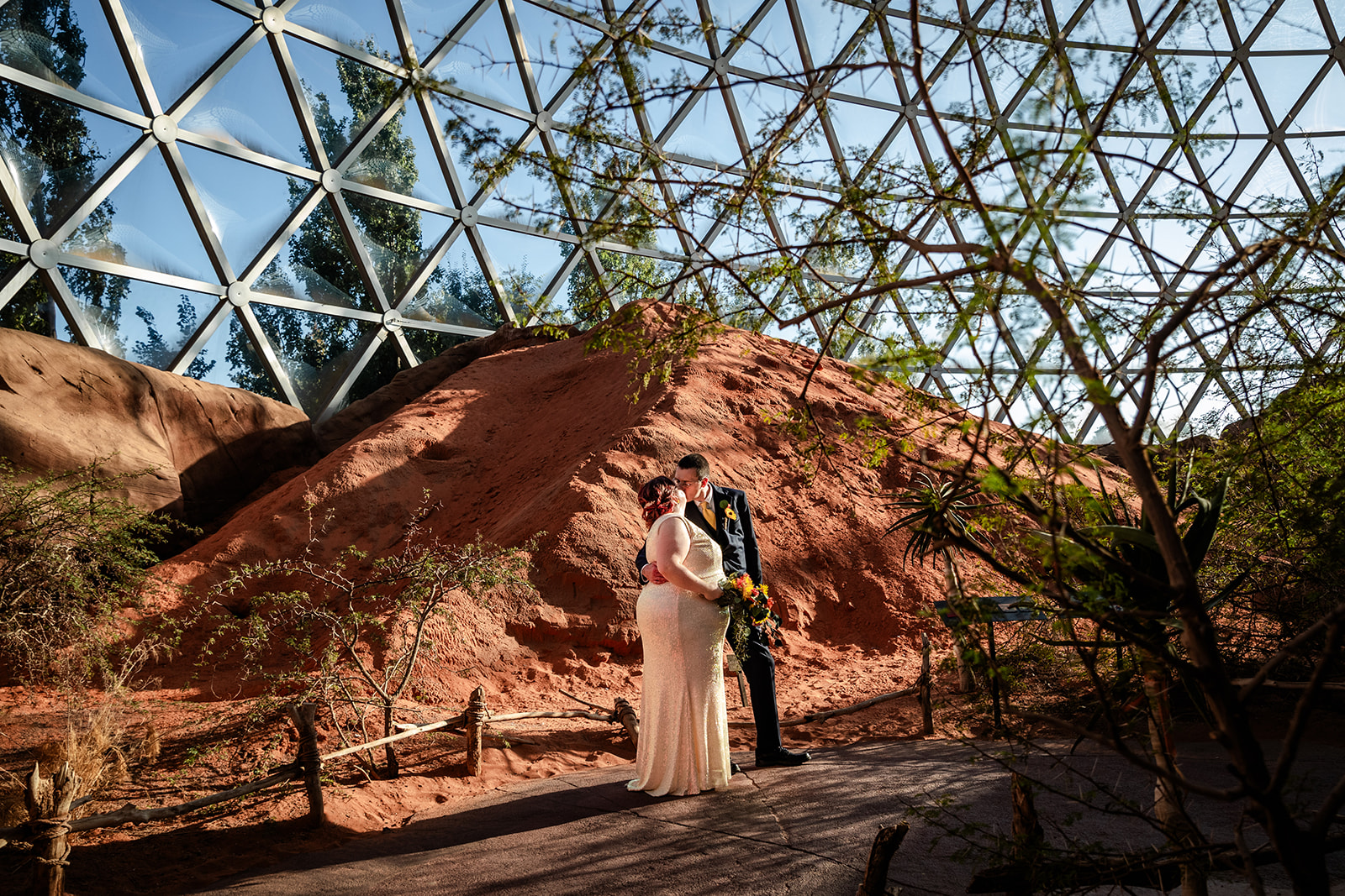 Bride and Groom on their wedding day in the desert dome at Omaha Henry Doorly Zoo