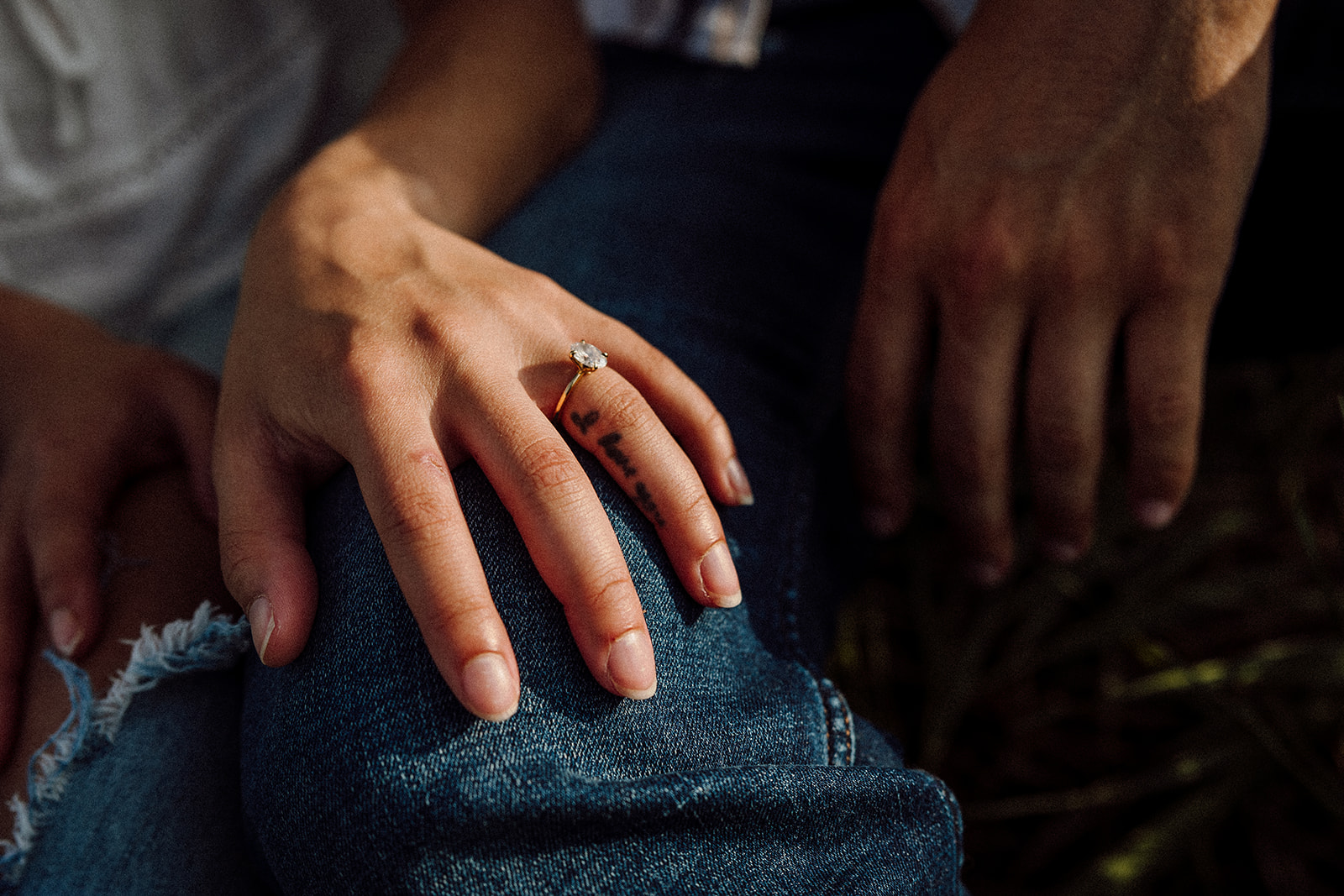 A close up of a woman and man's hands