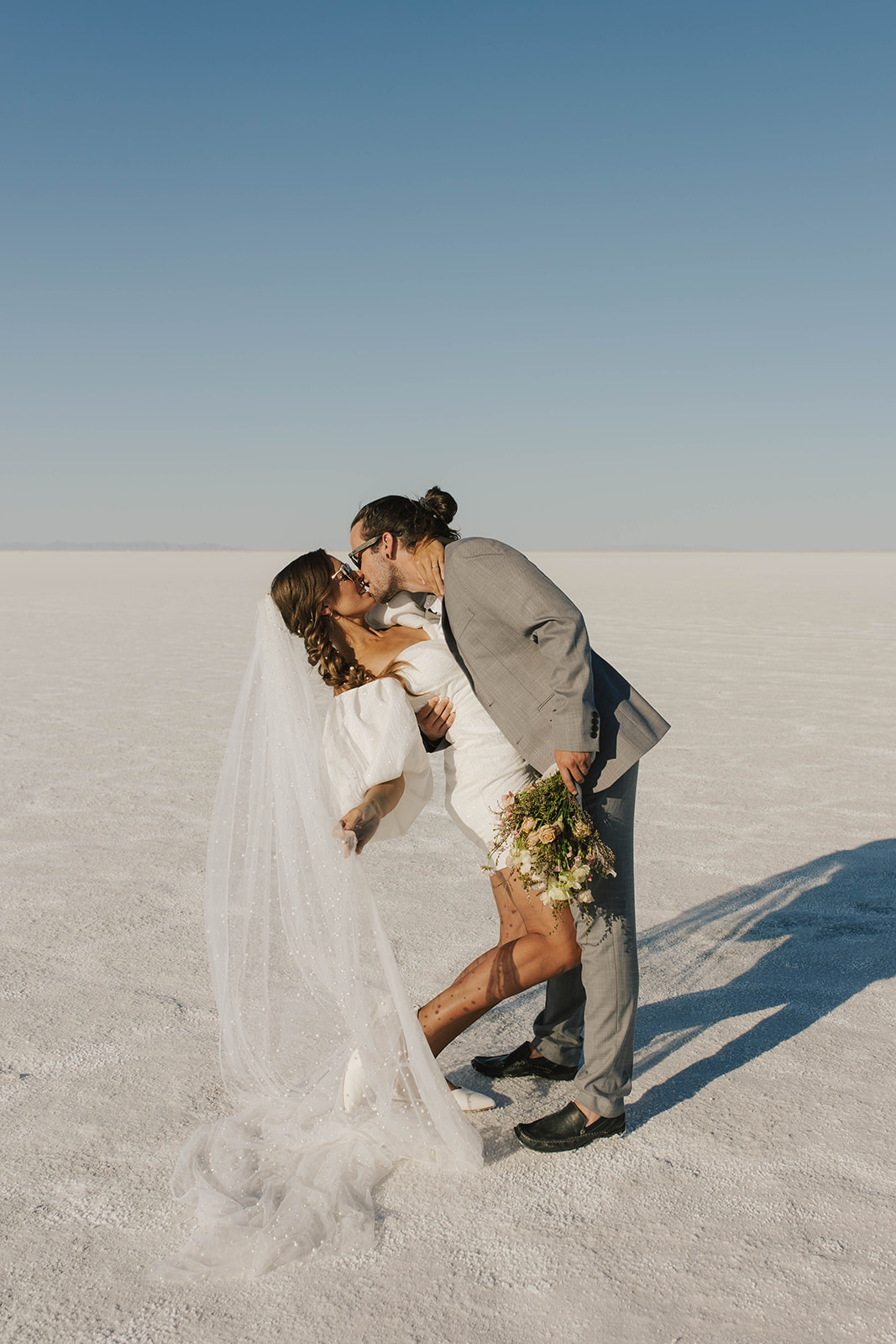 couple embraces at salt flats elopement