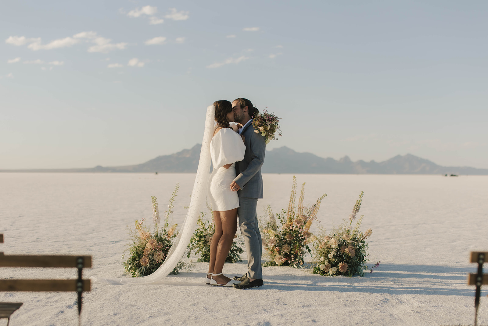 couple kisses at salt flats elopement