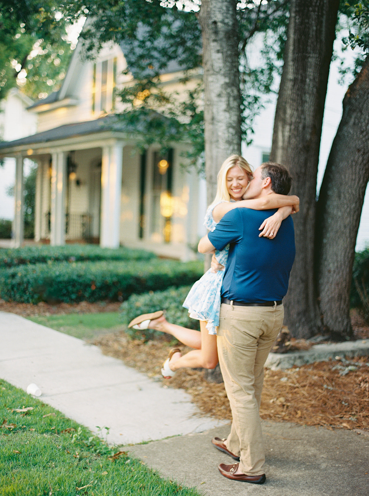 Engagement Session couple walking in downtown Thomasville, GA using Contax 645 camera.