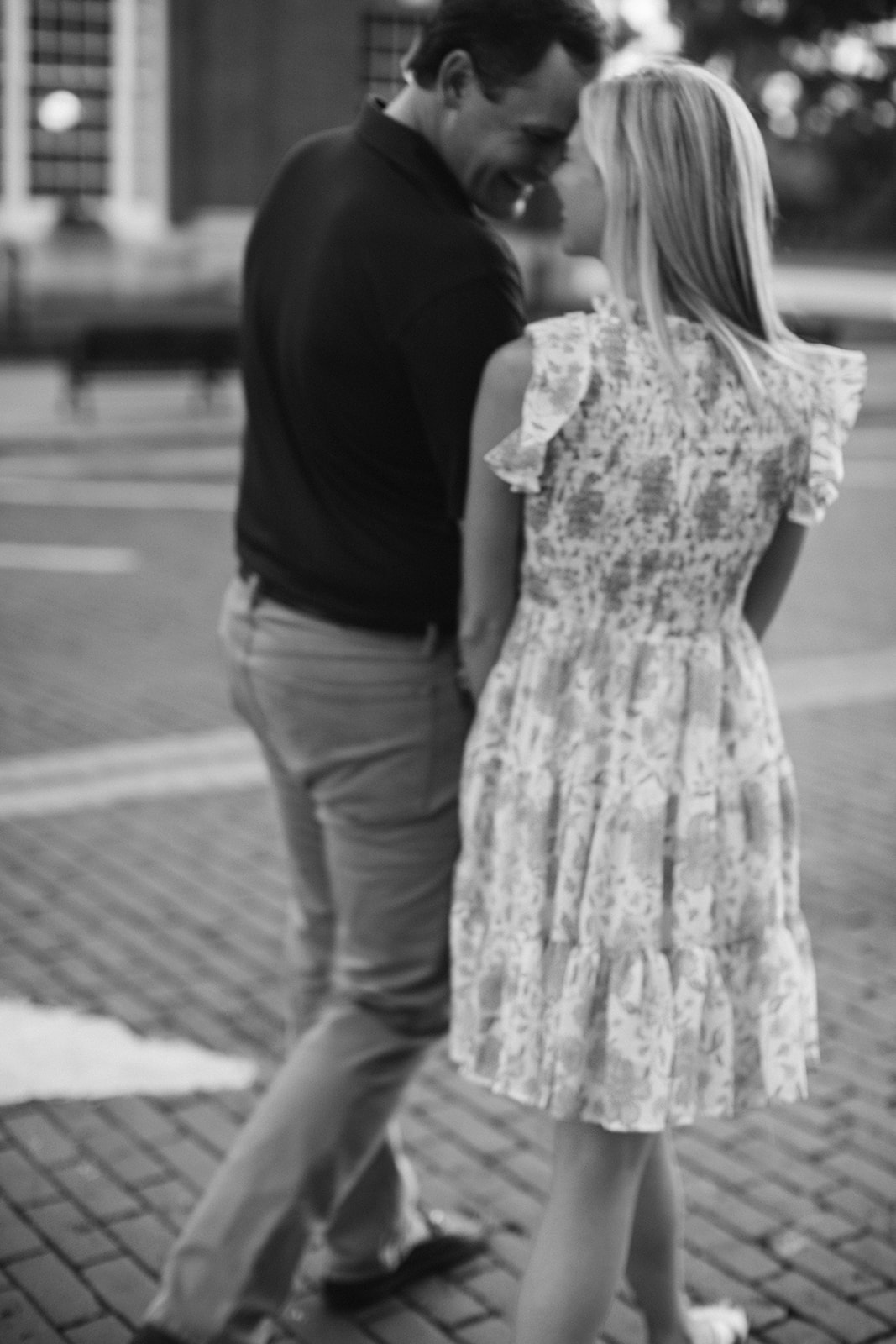 Engagement Session couple walking in downtown Thomasville, GA. Black and White photo