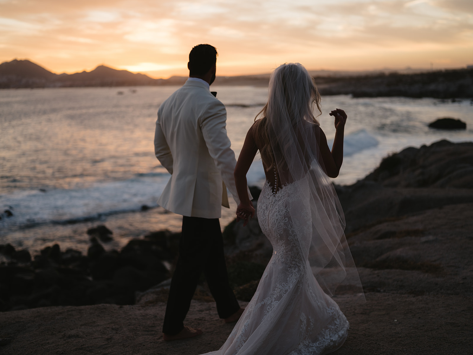 bride and groom enjoy sunset at the cape hotel