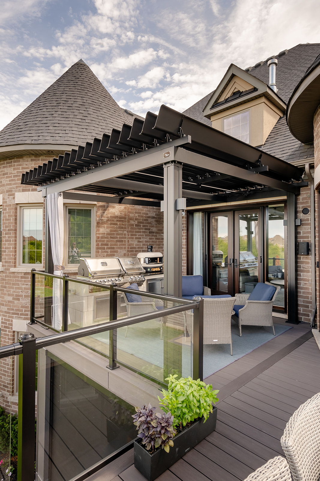 An outdoor patio set on the deck with a gazebo overtop.