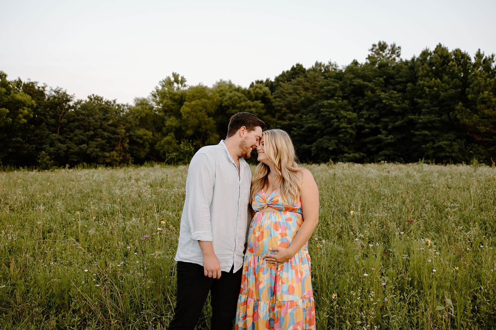 Wildflower field couples and pregnancy announcement photos