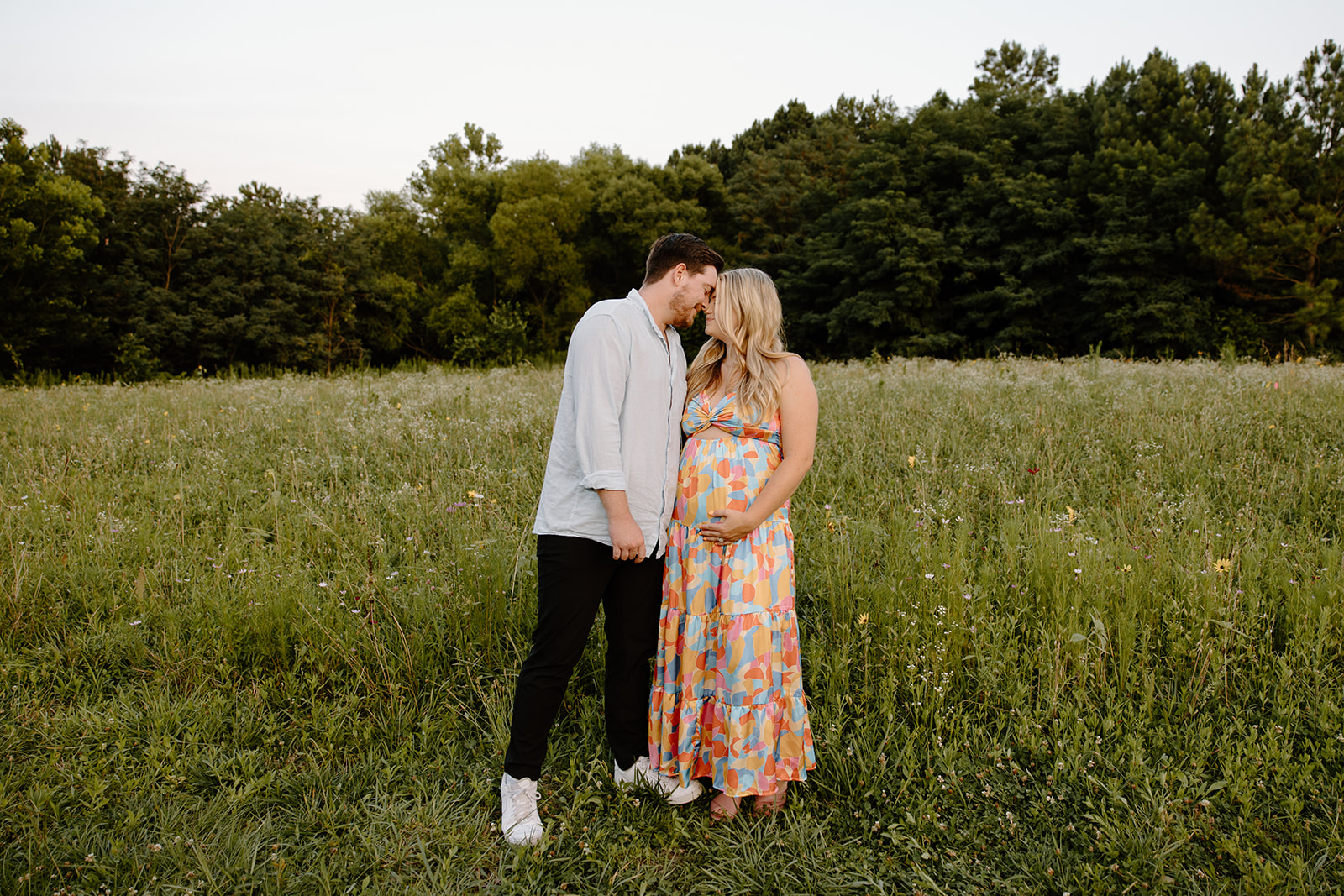 Wildflower field couples and pregnancy announcement photos