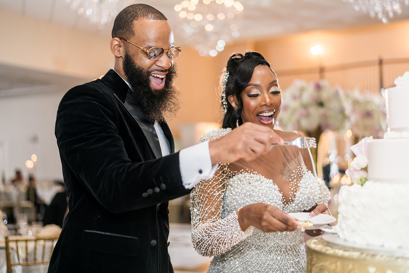 Cutting the wedding cake at the reception at Ashton Gardens Atlanta with JGraced Photography