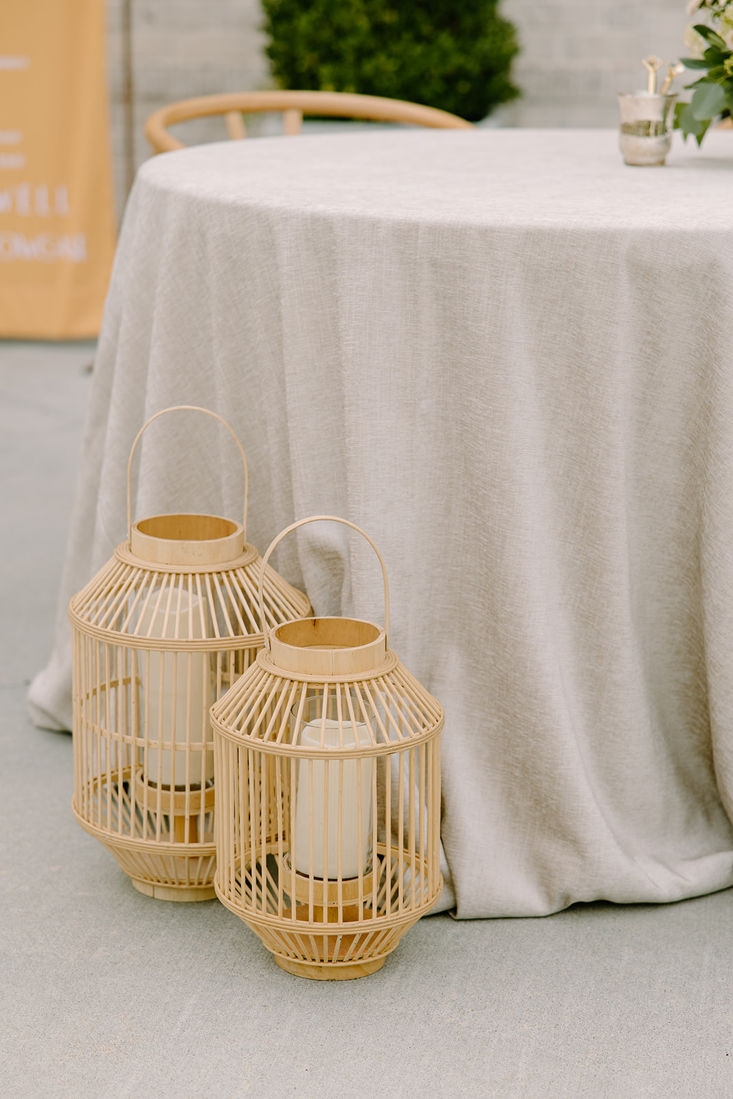 Summer wedding decor with rattan lanterns captured by Raleigh wedding photographers