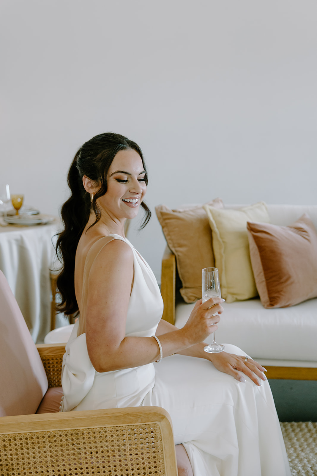 Bride at summer wedding lounge area captured by Raleigh wedding photographers