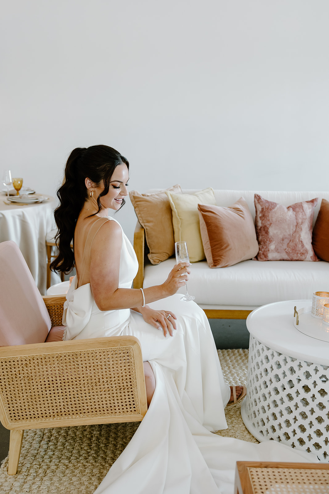 Bride at summer wedding lounge area captured by Raleigh wedding photographers