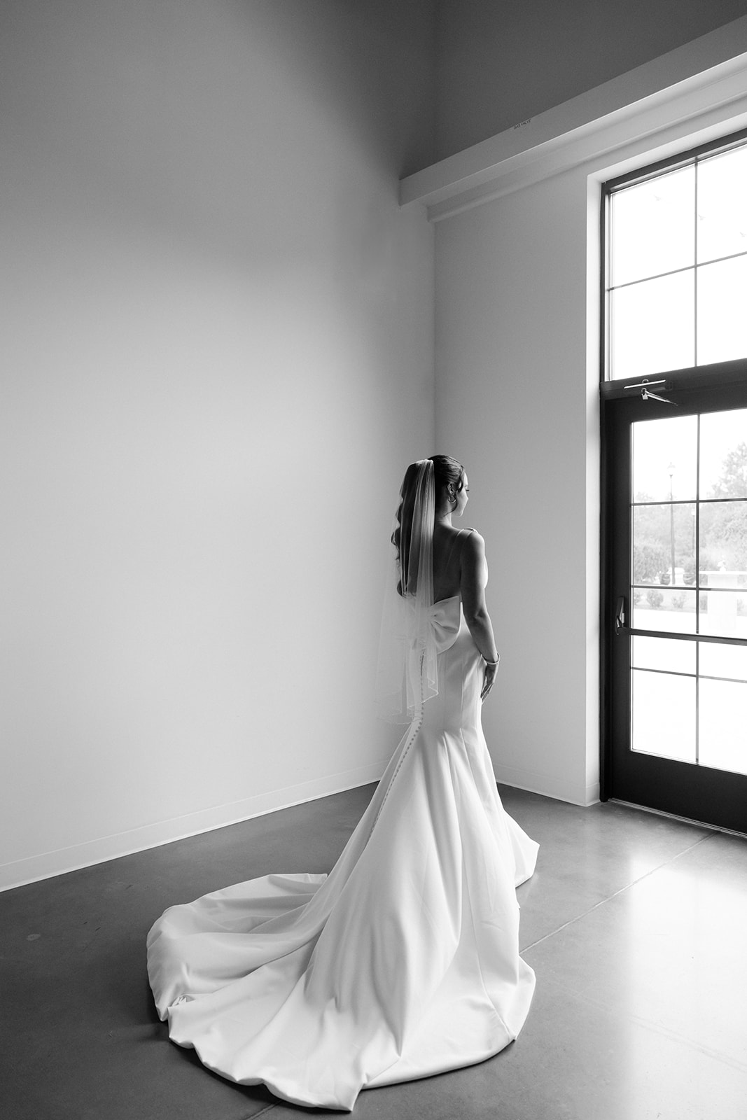 Classy bridal look and dress with bow captured by Raleigh wedding photographers