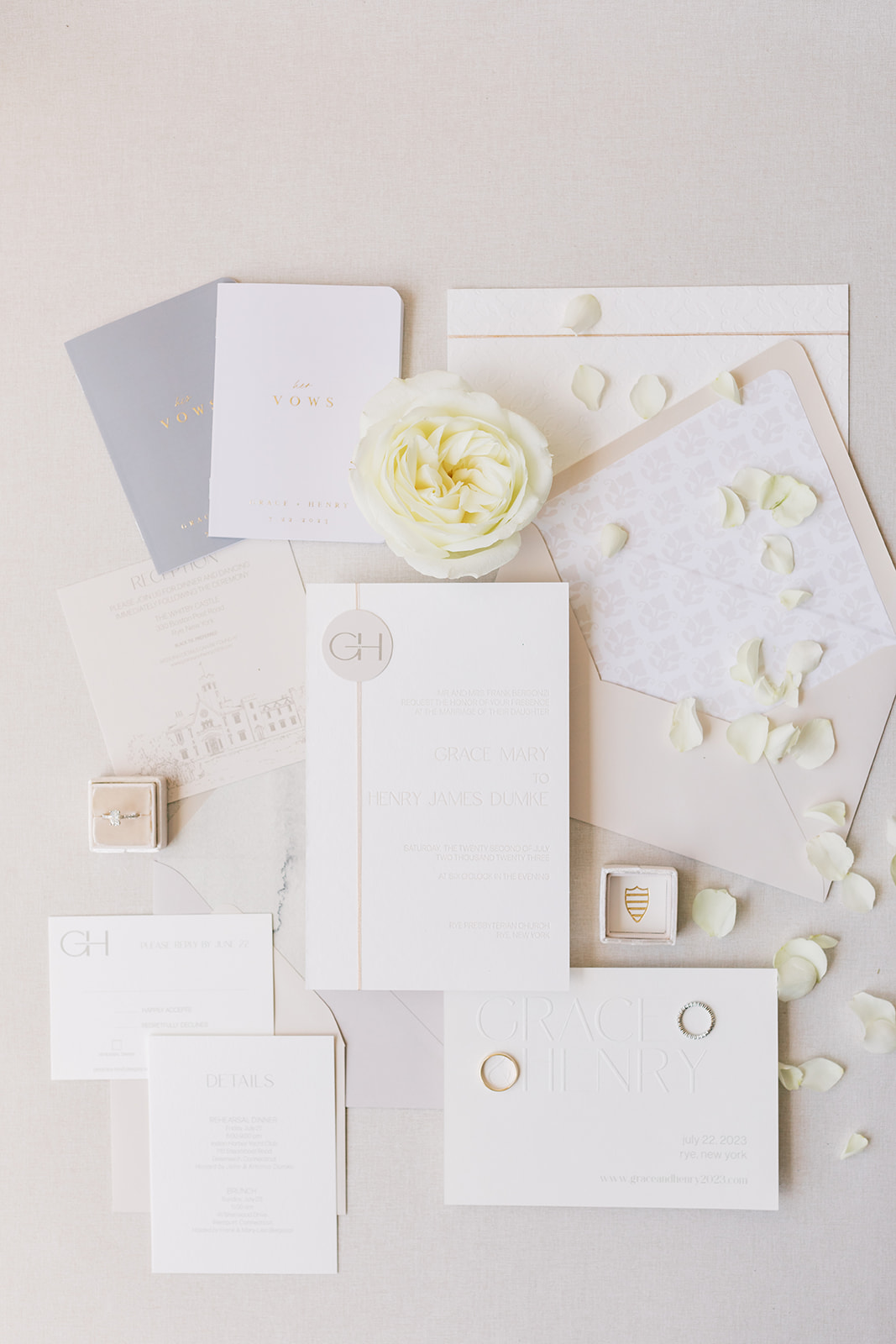 Wedding details with invitation suite with neutrals, champagne, and taupe tones