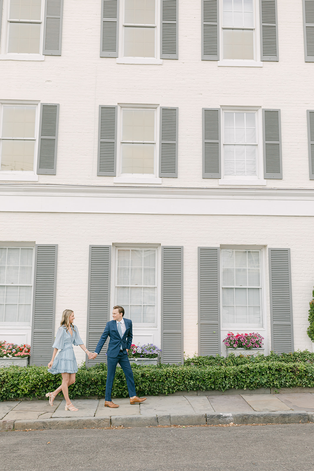 photo of engaged couple walking the streets of westport connecticut during engagement photo session