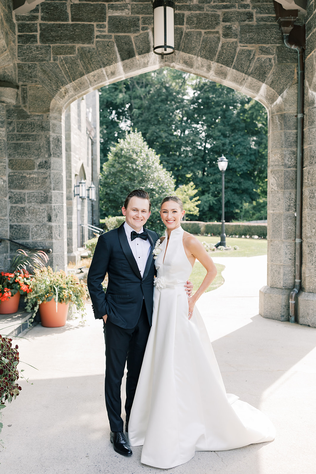 bride and groom portrait outside of whitby castle in rye new york