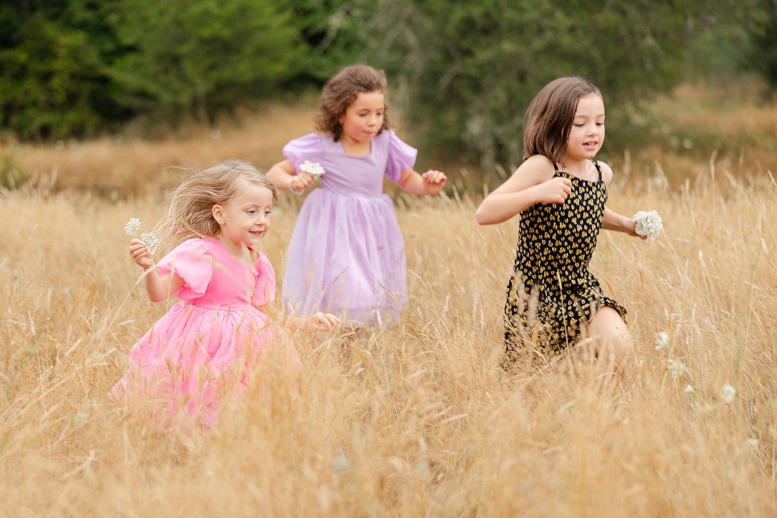 Children running in the field during a wedding