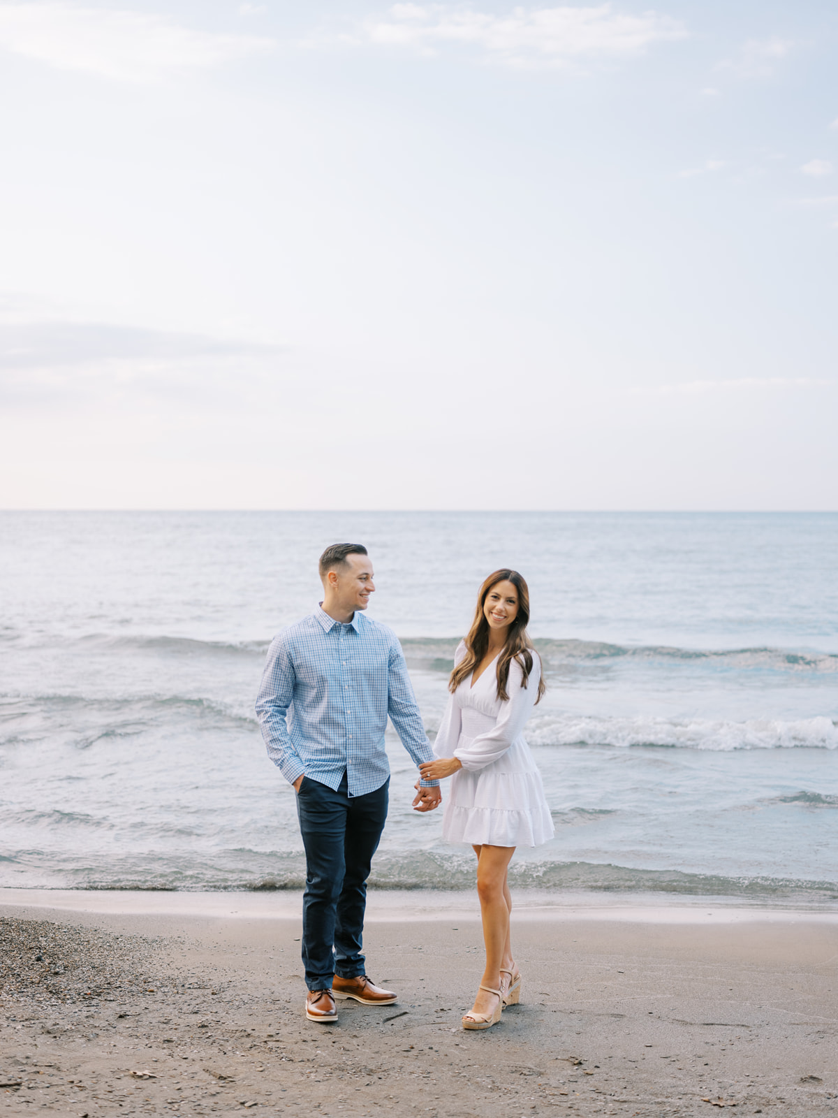 Couple posing for a photos at their engagement session in Charleston South Carolina