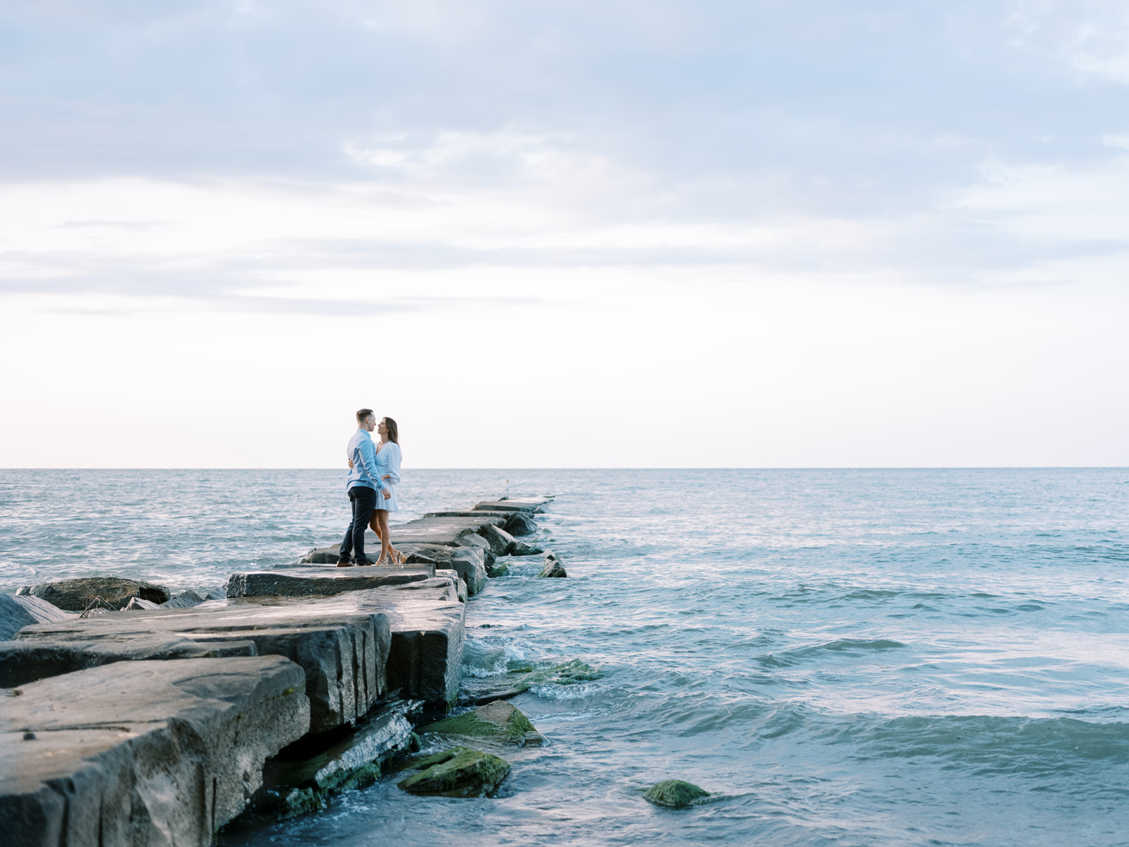 Couple posing for a photos at their engagement session in Charleston South Carolina