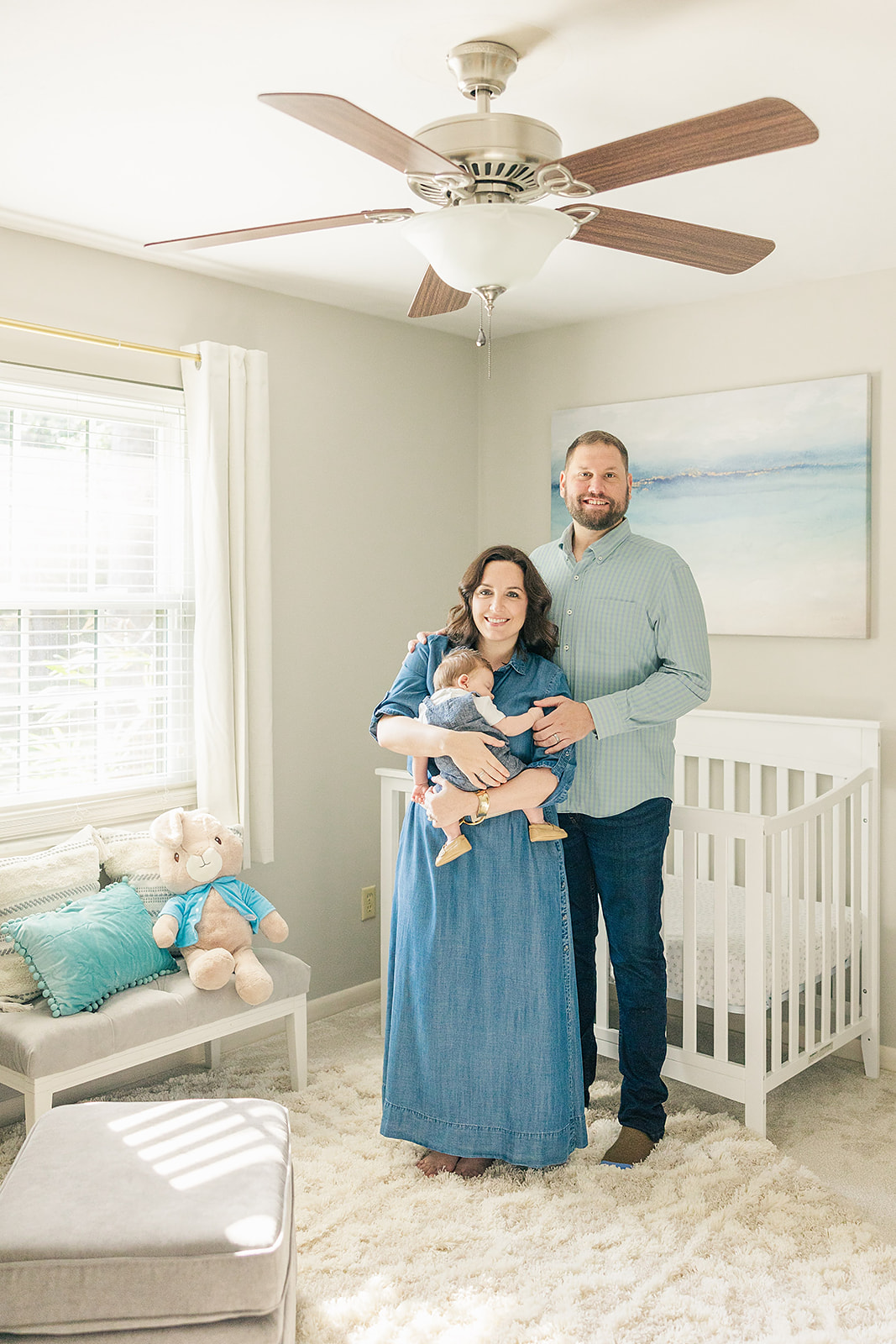 Newborn Baby Boy Photography in a Blue, Teal, and Cream Nursery: Capturing Joyful Moments in a Calm Environment