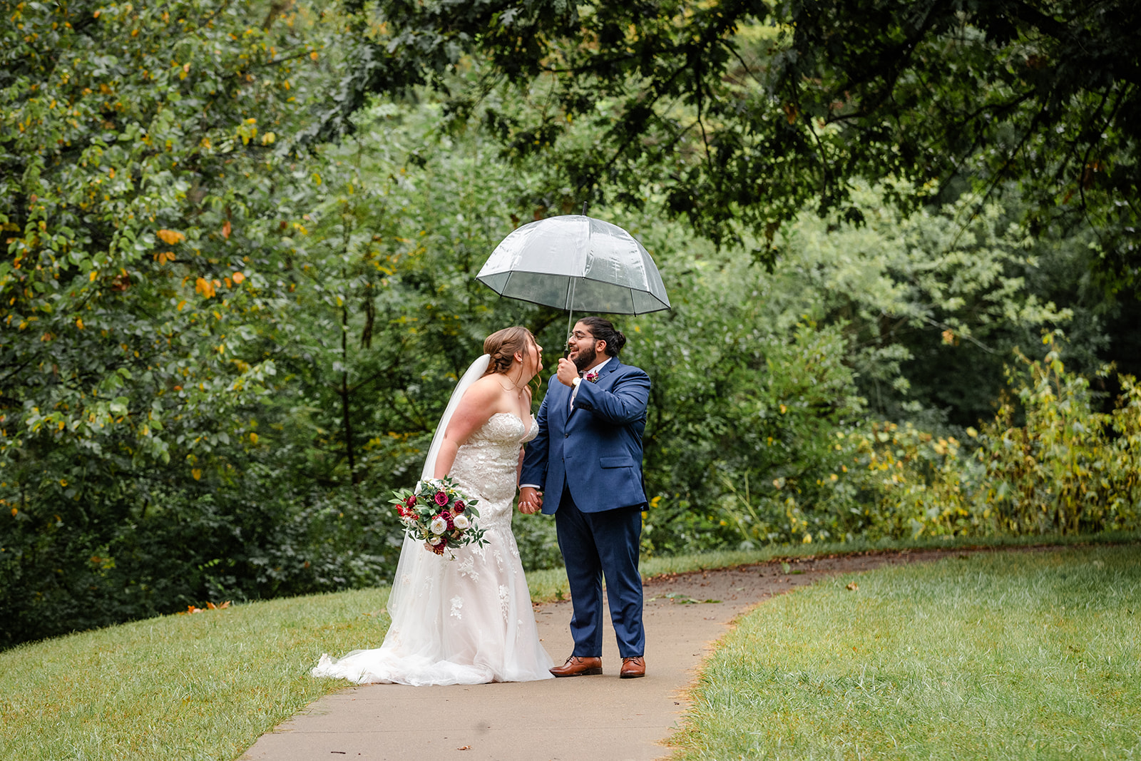 Bride and Groom under a umbrella
