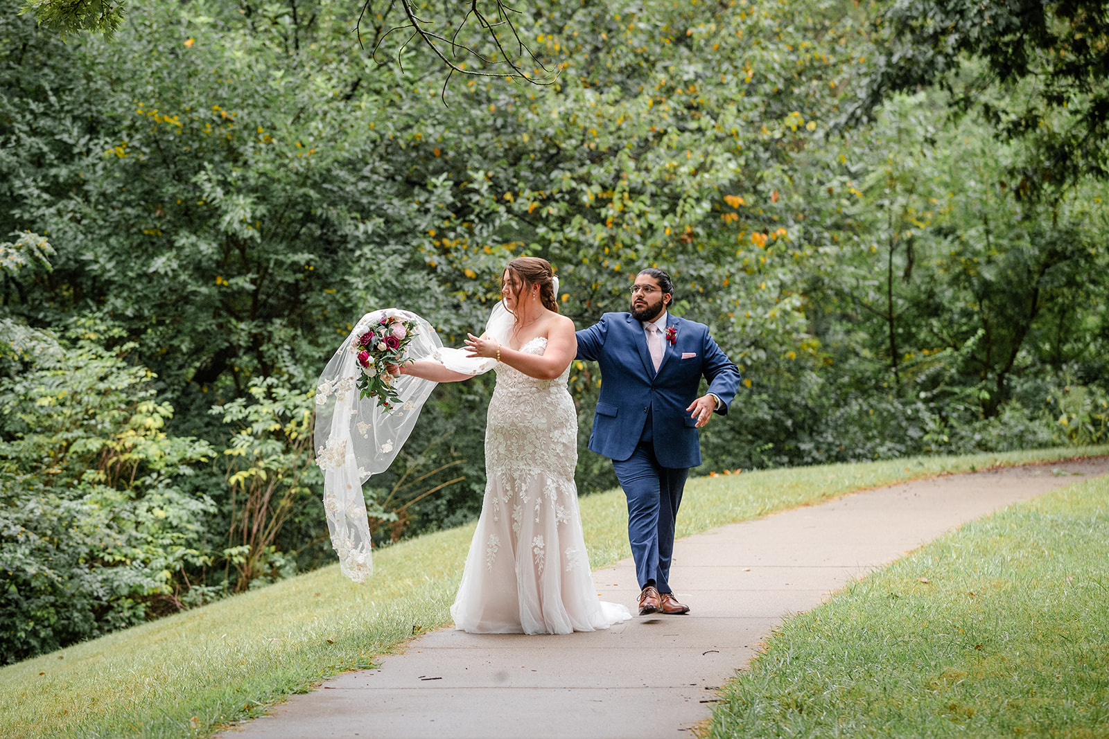 Bride and Groom walking on path at Meadow Lane Park