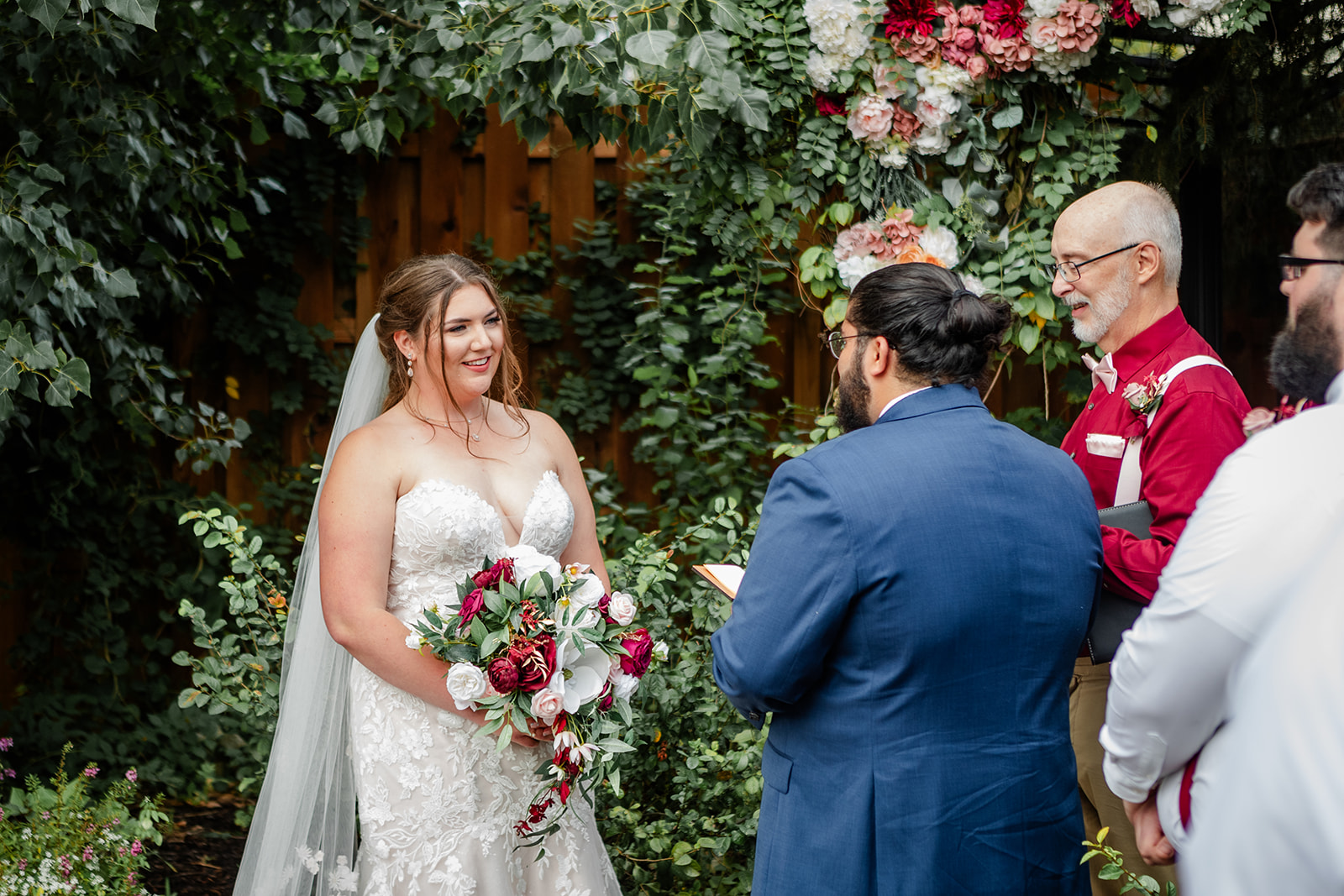 Bride laughing during vows at wedding 