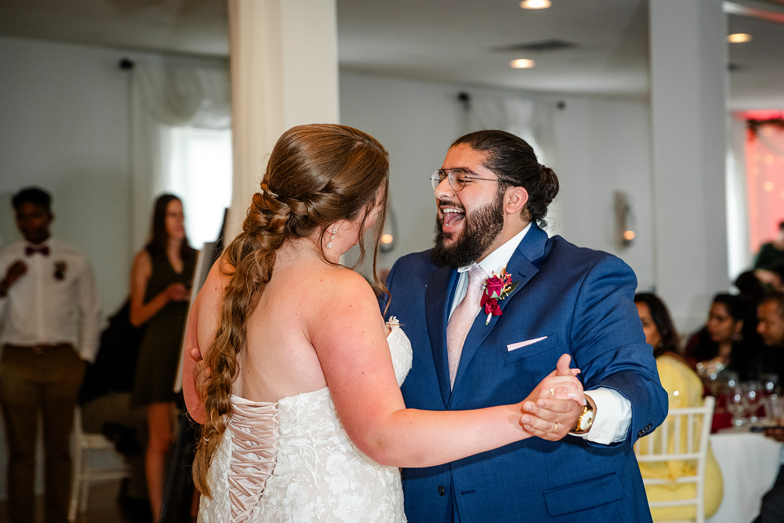 Groom smiling during first dance