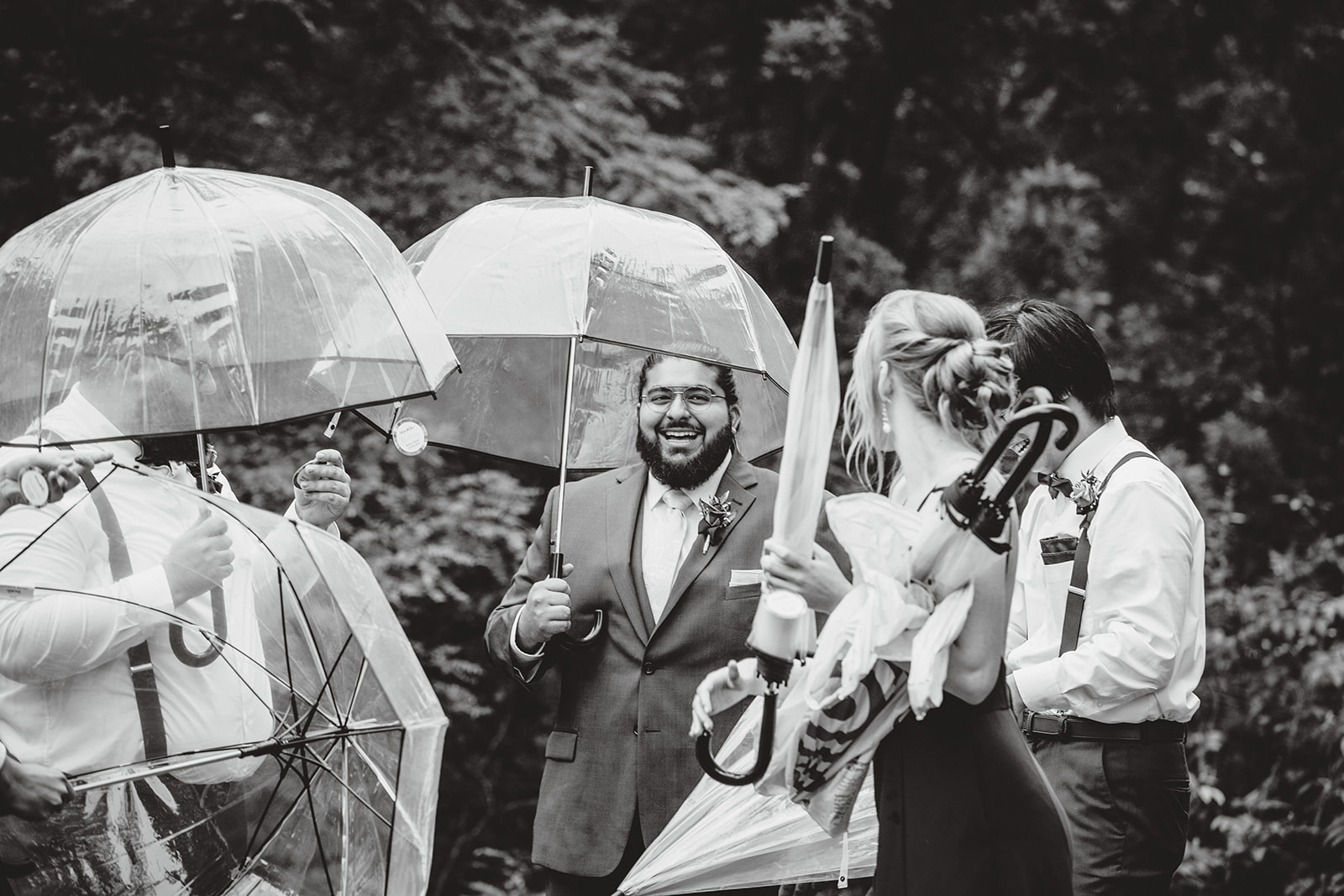 Wedding party with umbrellas