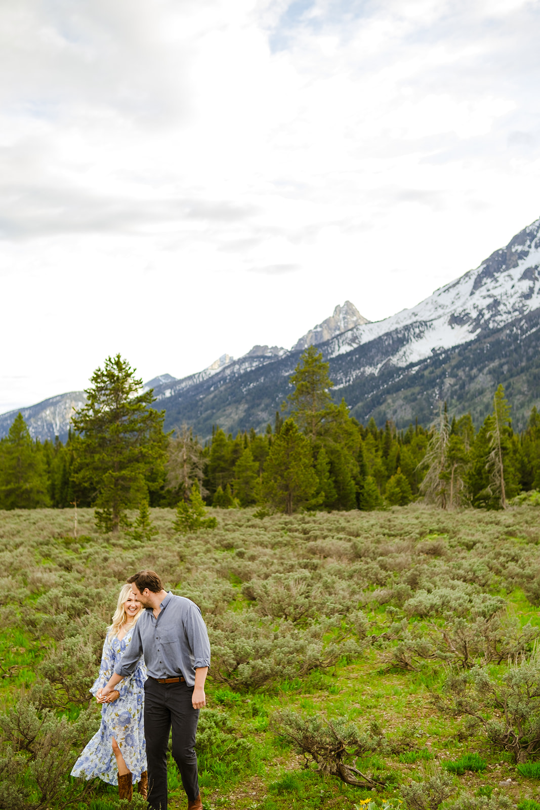 Couple engagement photos at mormon row barns Grand Teton National Park - Jackson Hole Photographer