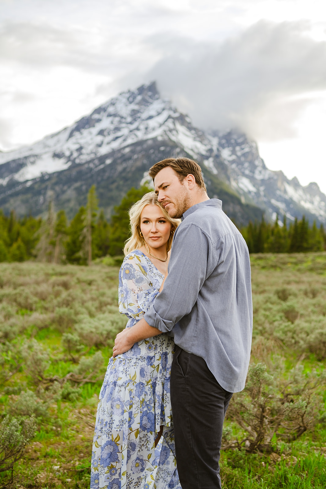 Couple engagement photos at mormon row barns Grand Teton National Park - Jackson Hole Photographer