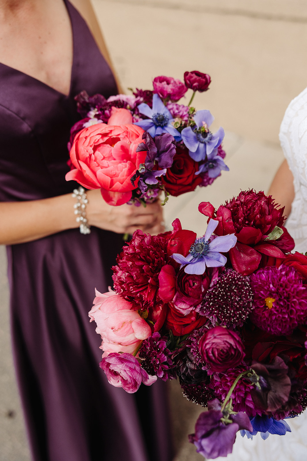 Purple and pink wedding bouquets that go beautifully with the maid of honor's purple dress.