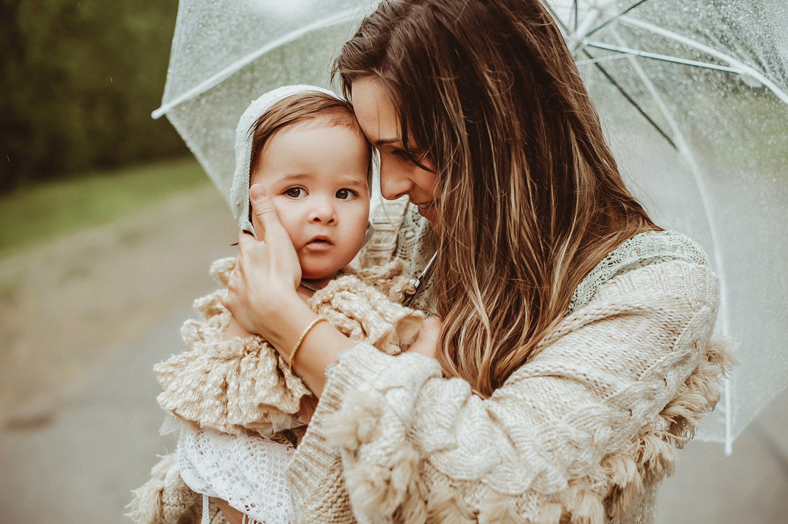 sweet moments between mother and daughter during a rainy day session in Uxbridge