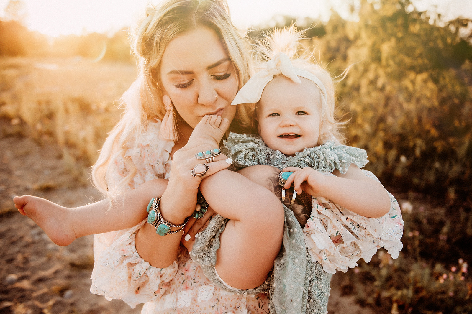 playful photos of mom and daughter at golden hour