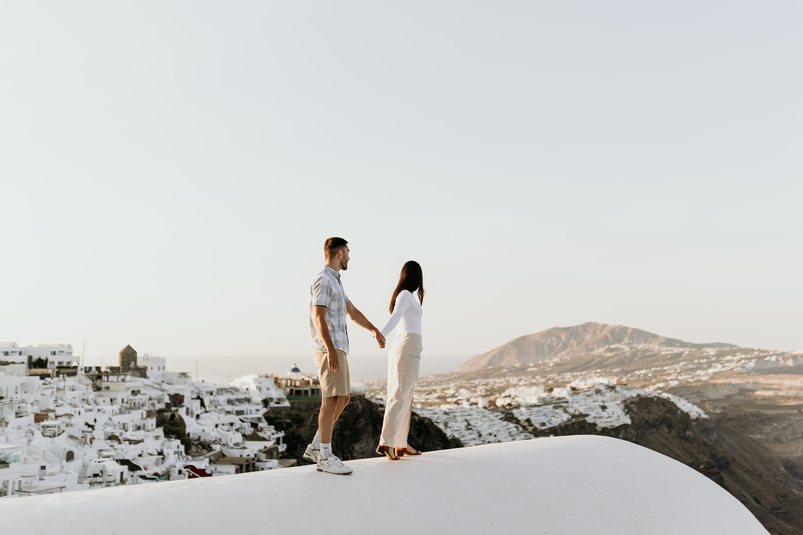 A couple enjoys the view in Santorini, Greece 