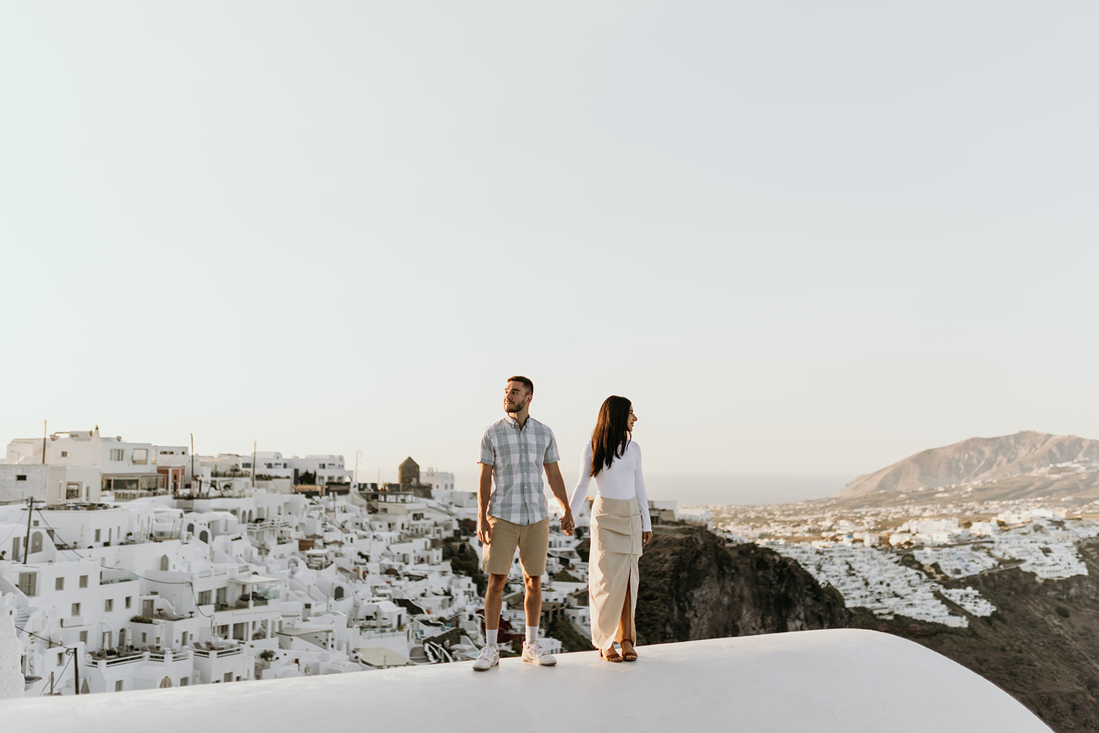 A couple enjoys the view in Santorini, Greece 