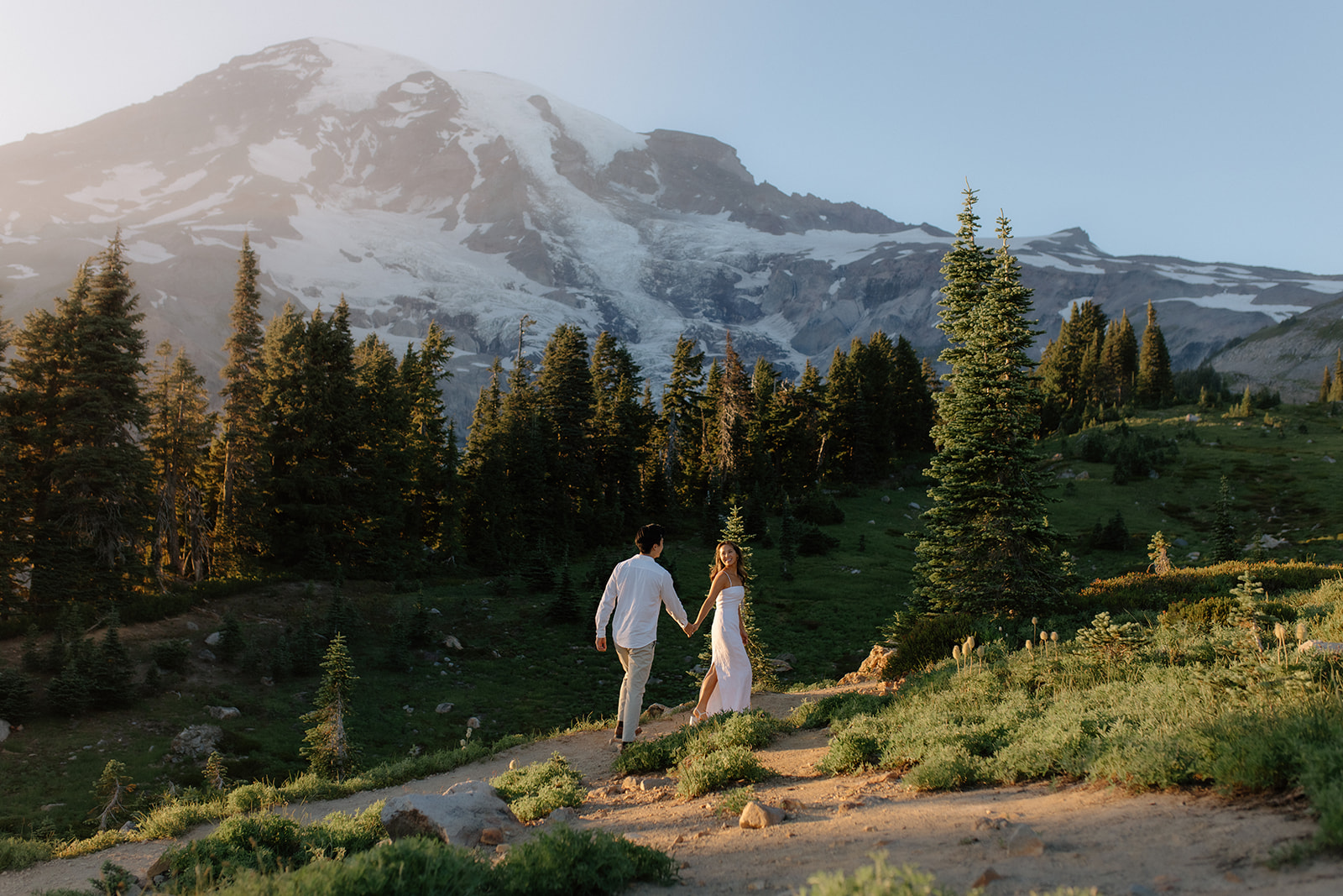 Couple exploring paradise meadow in Mount Rainier National Park.