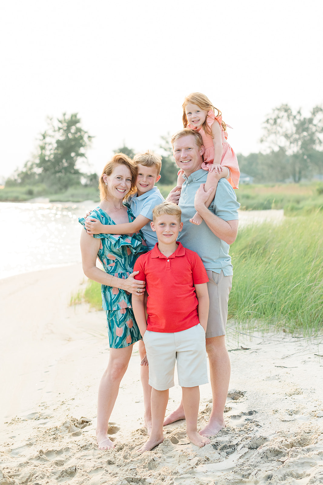Family of five poses on the beach at this St Leonard Maryland family session 