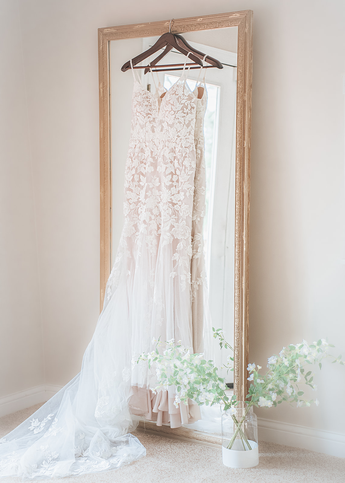 Artistic shot of dress hanging on mirror
