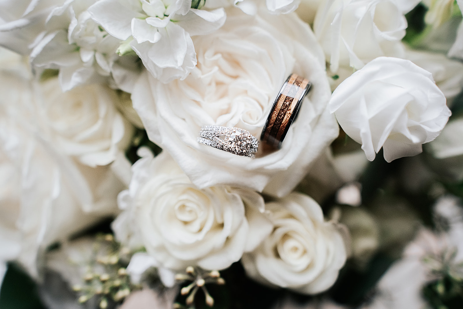 Artistic wedding bouquet with rings in flower