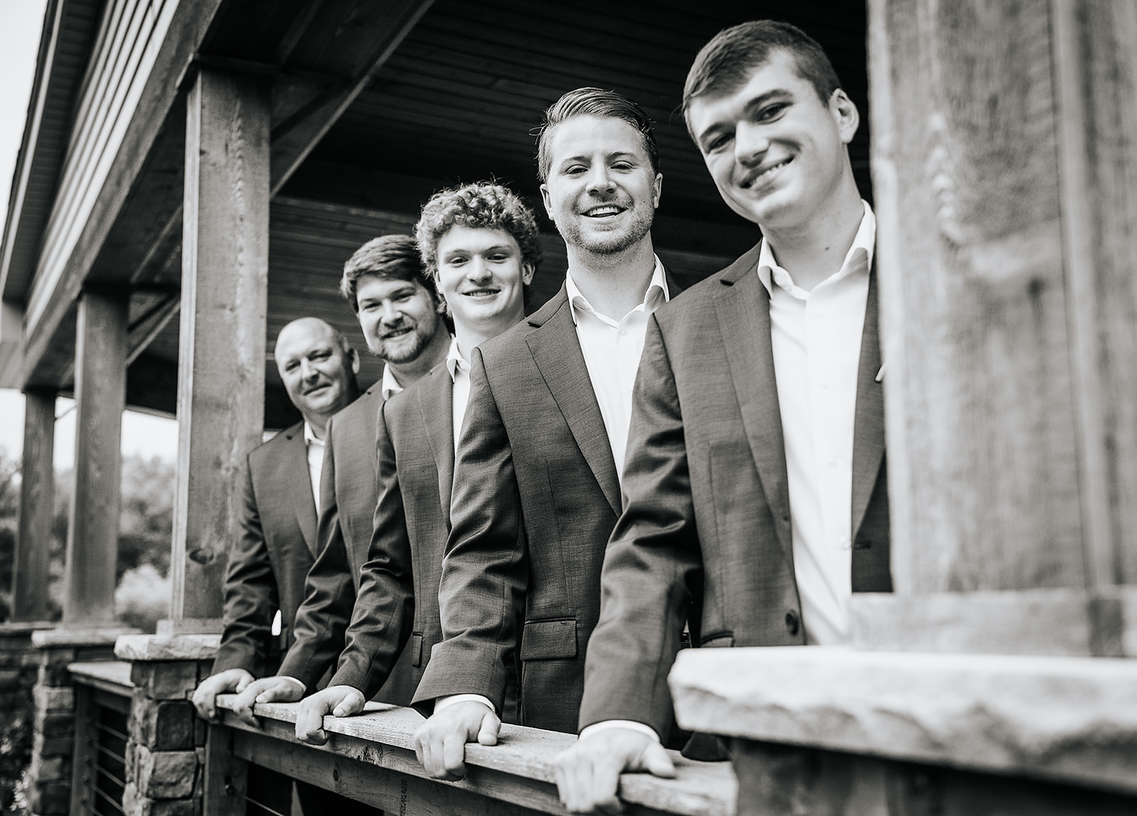 Black and white bridal party image of groomsmen