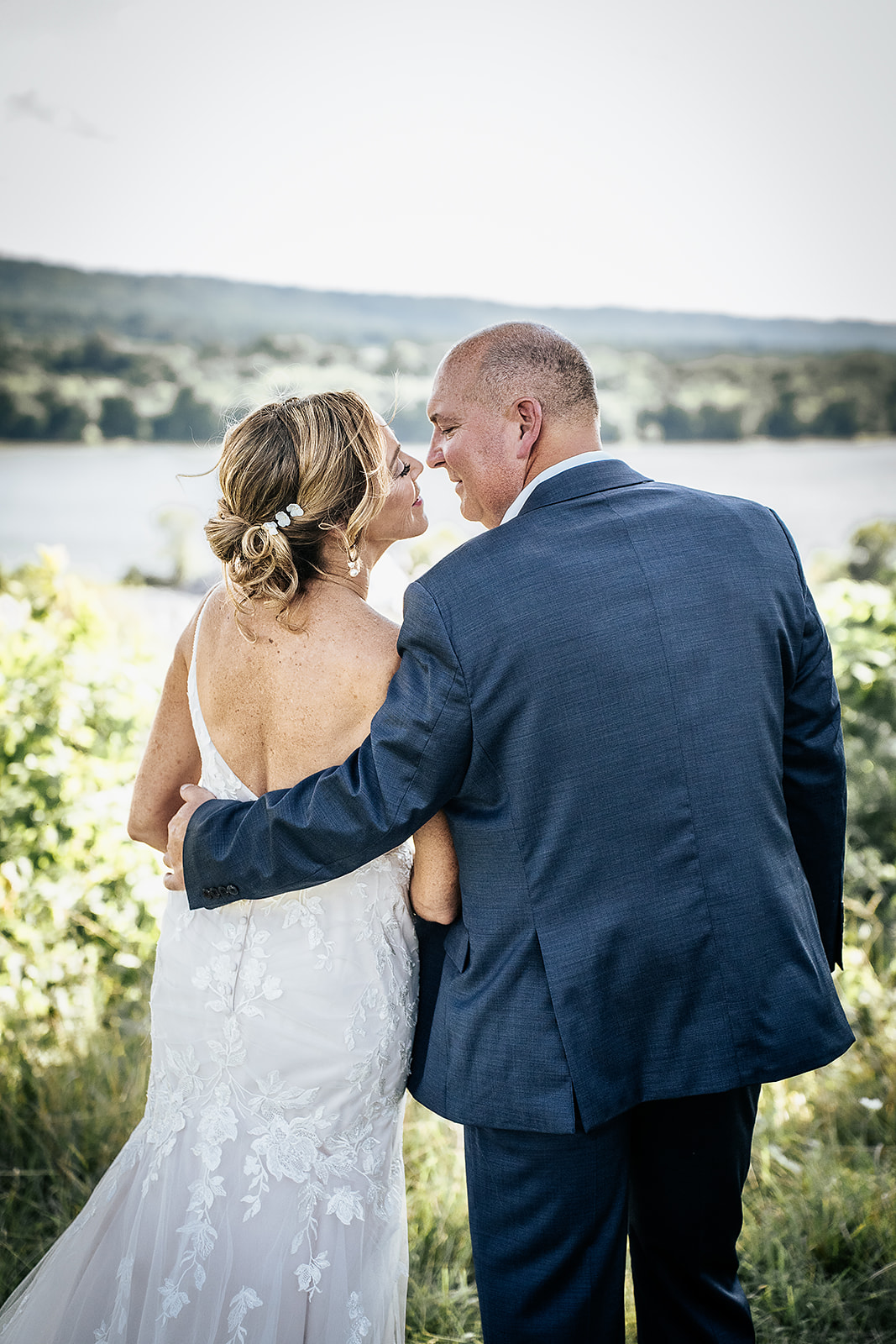 Bridal couple overlooking Ohio River at Aston Oaks Golf Club
