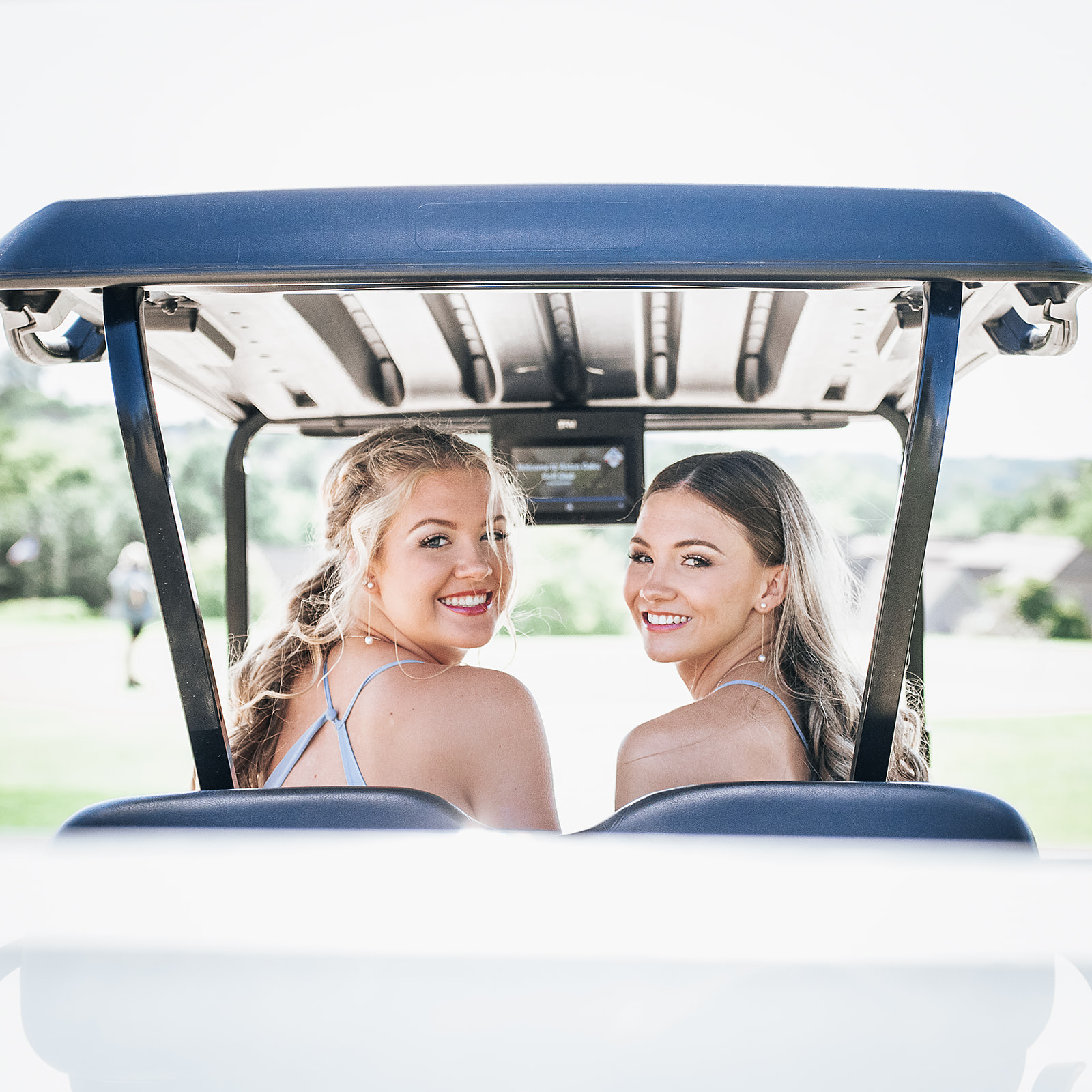 Bridesmaids on golf cart at Aston Oaks Golf Club