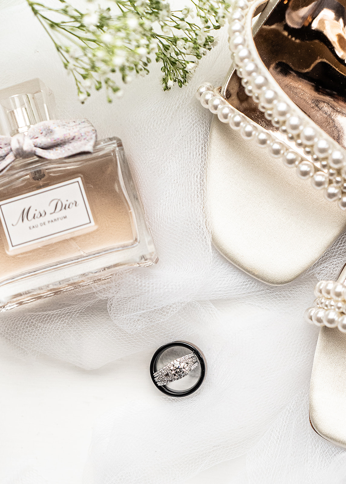 Elegant wedding details with Dior purfume rings and brides shoes