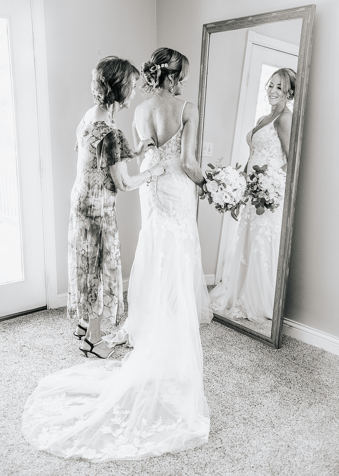 Mother of the bride black and white in mirror