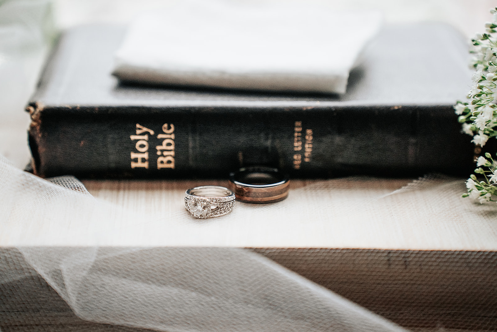 Wedding details image of bible with rings and tulle 