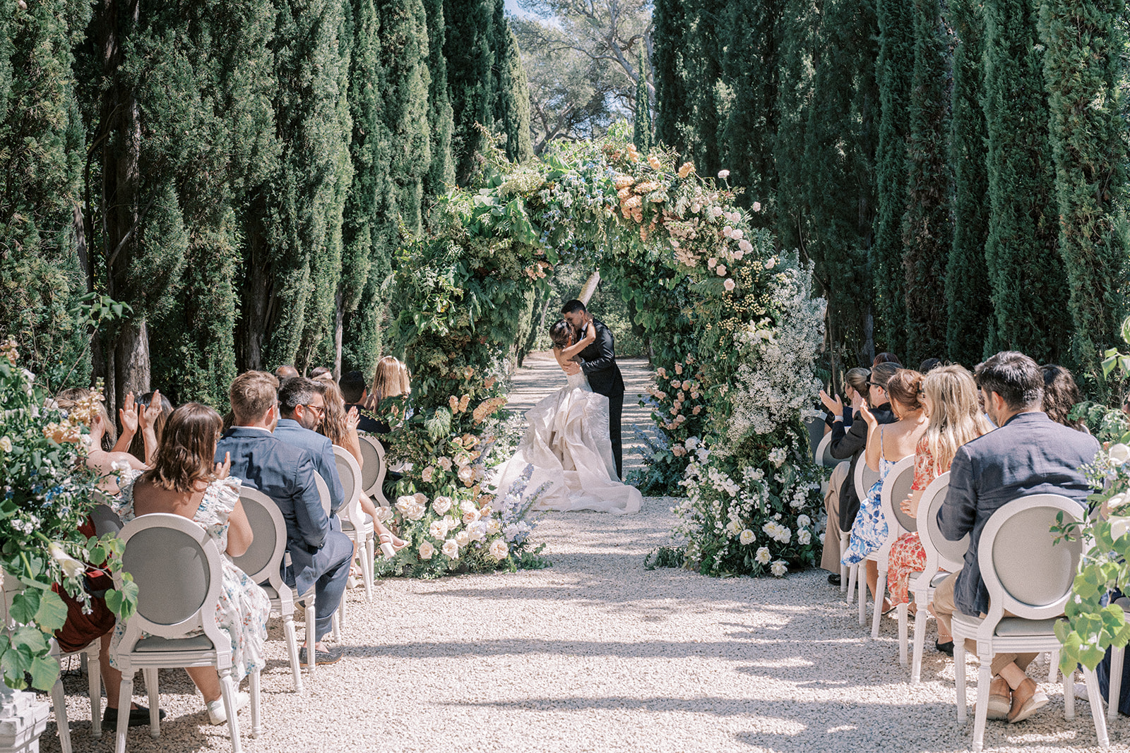 Luxury outdoor wedding ceremony with floral arch