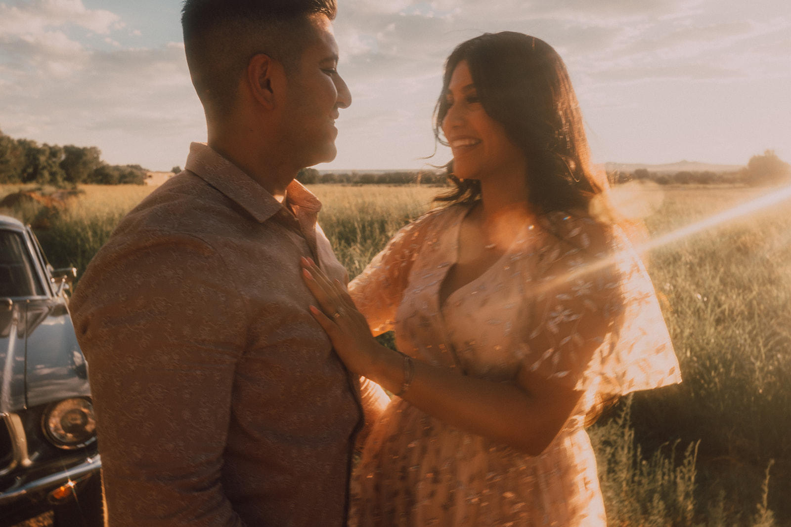 sunset maternity session with vintage car at golden hour
